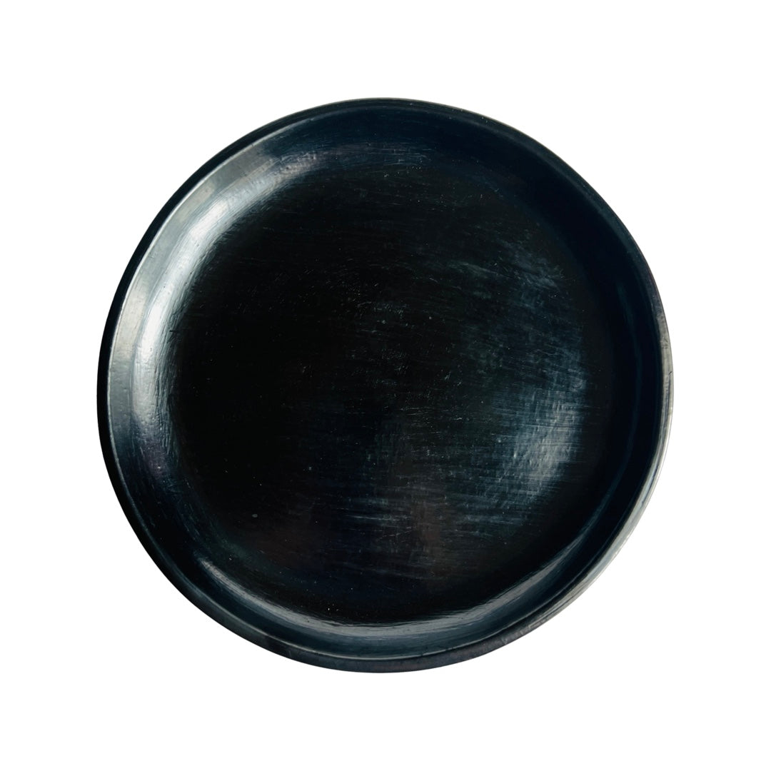 Top view of a barro negro, black clay, plate.