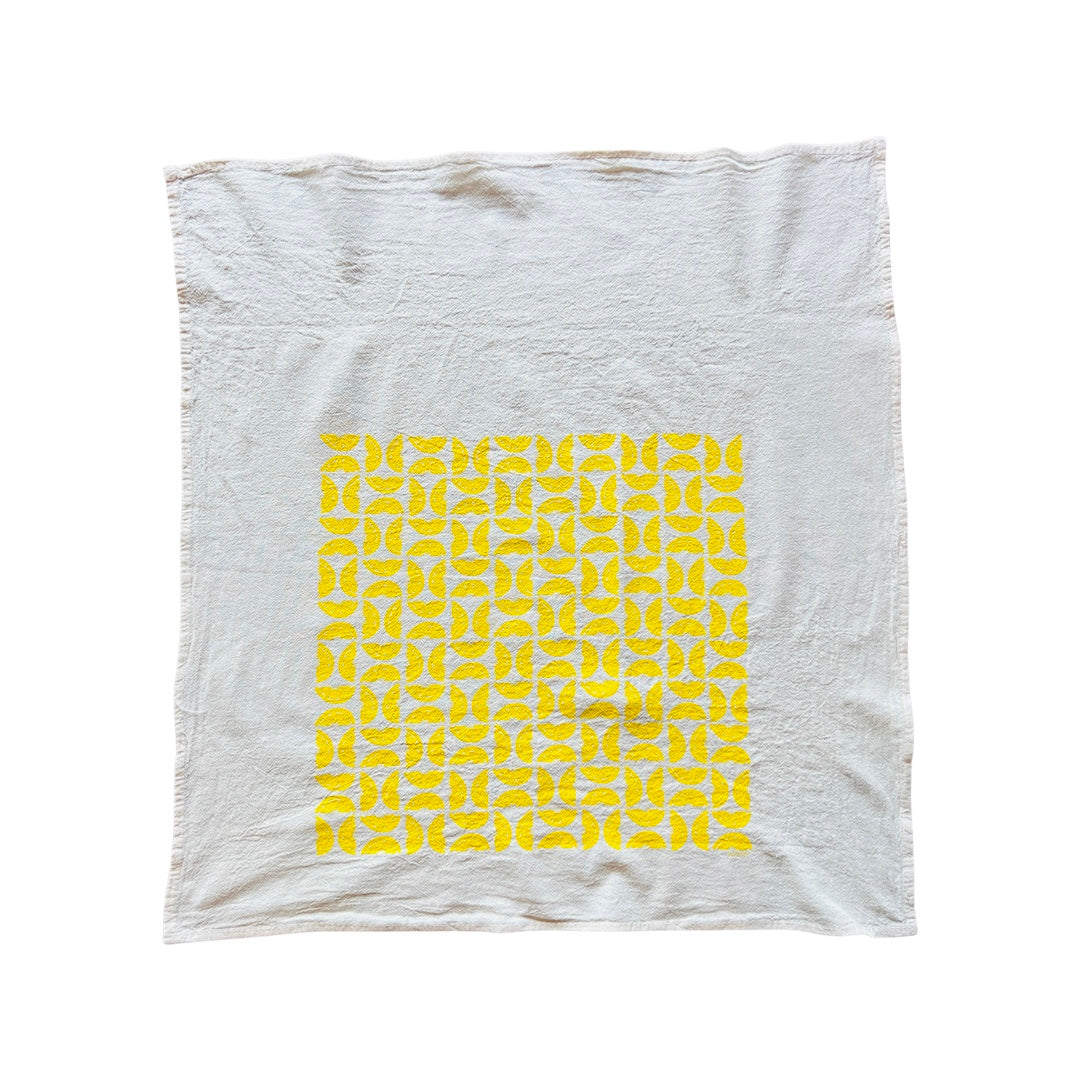 Full Tea Towel features graphic of sliced lemons.